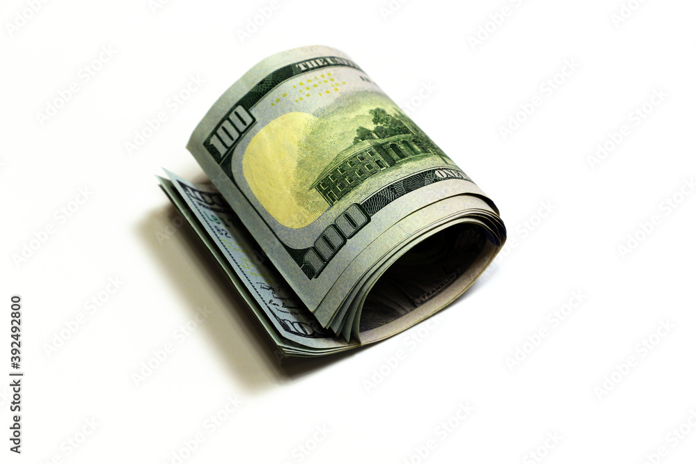 Dollars on a white background. Rolled-up bills. Dollars on a white background. Rolled-up bills.