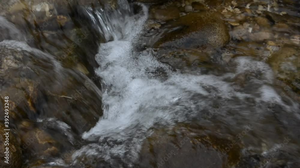 A small waterfall on a mountain river. A small waterfall on a mountain river.