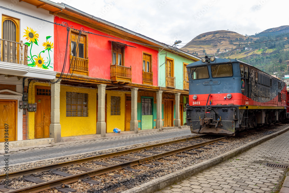 Ecuador, in the village of Alausi. Typical houses as well as the famous old wooden train on the railway station