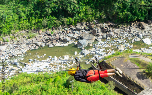 Ecuador, near Banos on the road of Waterfalls. Zip-lining over the the canyon near the Road of Waterfalls.