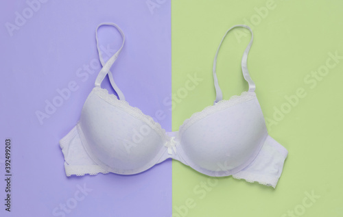 Stylish bra on colored background. Pastel color trend. Beauty and fashion minimalistic still life