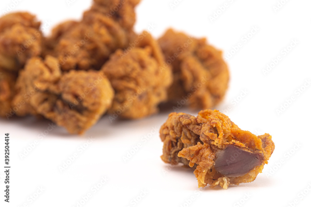 Fried and Crispy Chicken Gizzards on a White Background Fried and Crispy Chicken Gizzards on a White Background