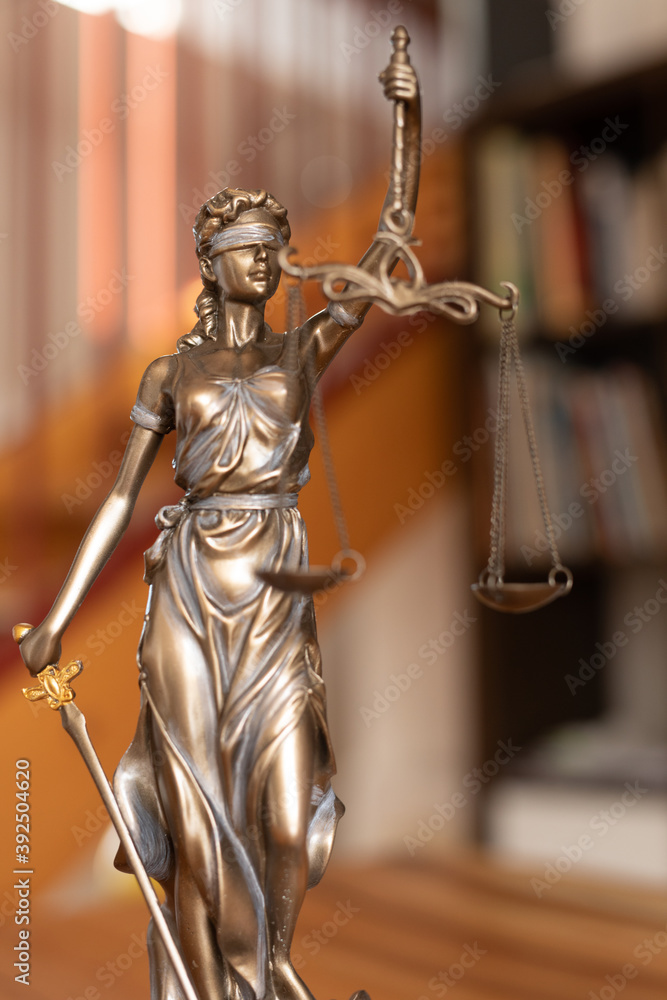 law symbol justice figure on wood table