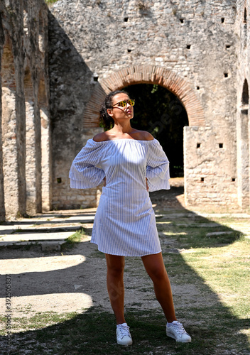 Young girl exploring an ruins of ancient city of Butrint.