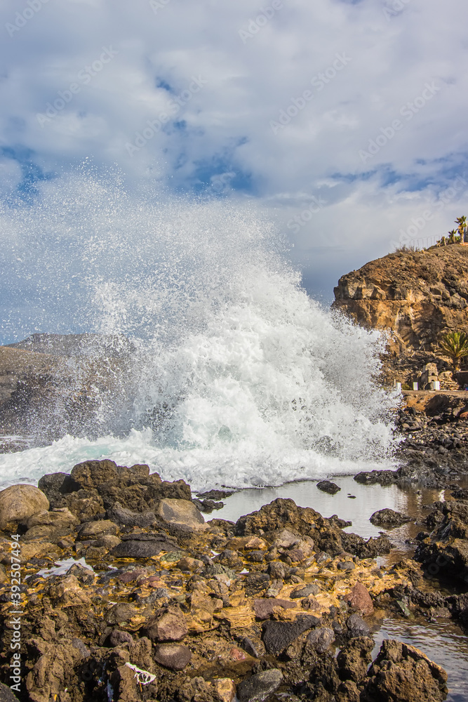 waves in a blue and green ocean near the coast