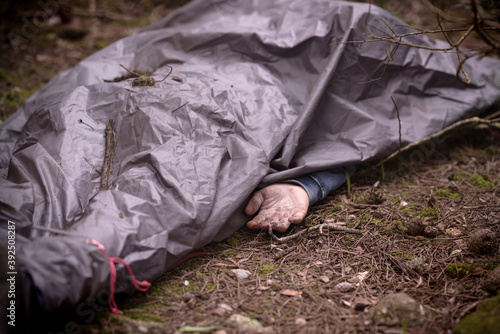 Caucasian man dead body in the woods. Murder in the forest. Found a dead body in the park.