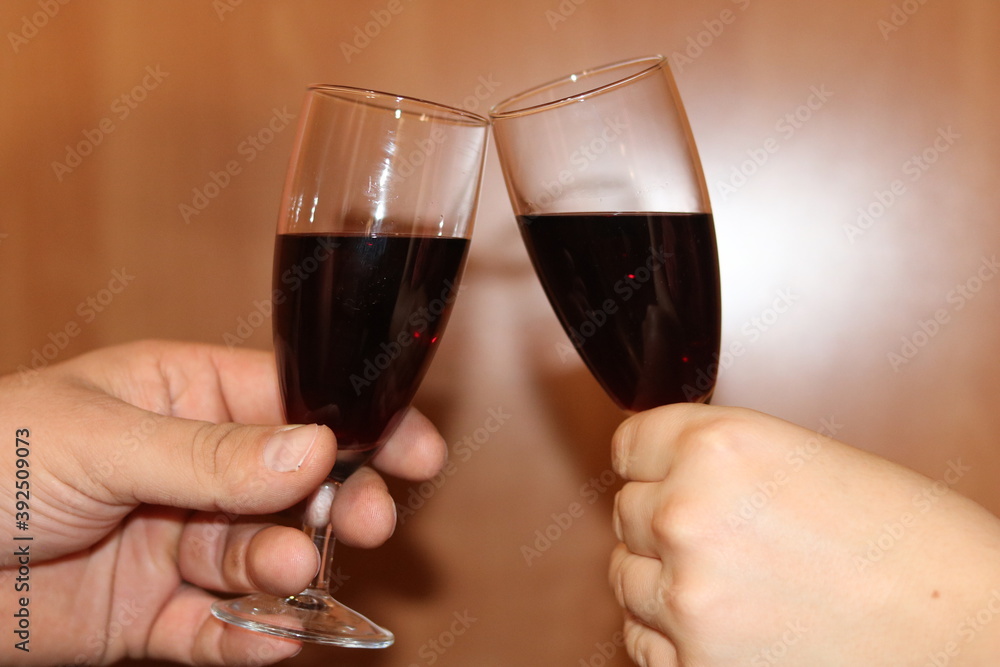 Toast with glasses of red wine, couple, love, valentines day.