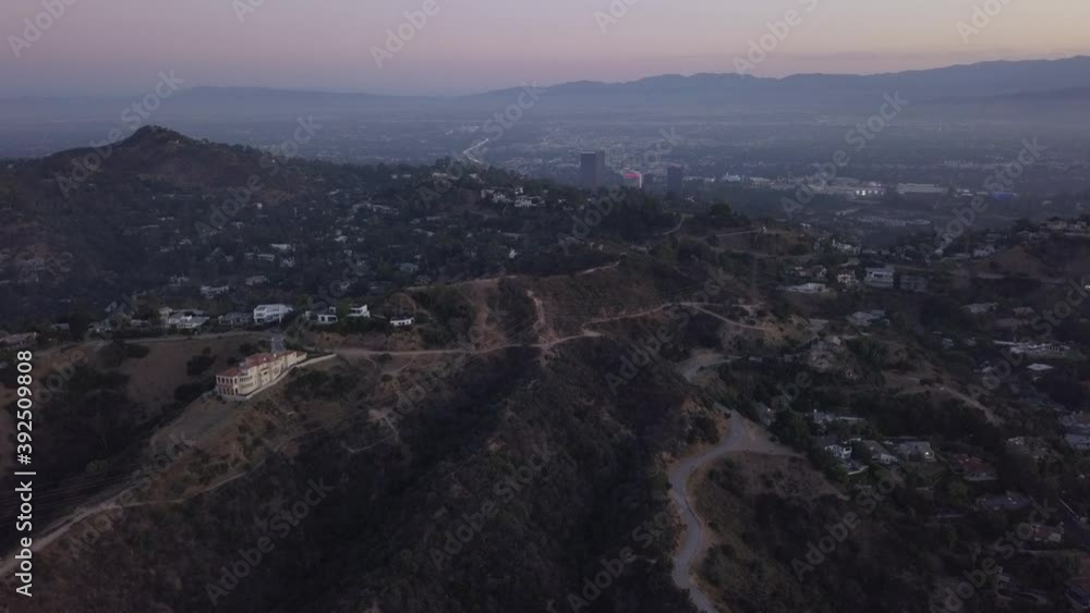 Hollywood Hills at Sunrise with view on Mountains and the valley, power lines in Los Angeles Cityscape view, Aerial Wide Angle Hollywood Hills at Sunrise with view on Mountains and the valley, power lines in Los Angeles Cityscape view, Aerial Wide Angle