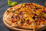 Vegetarian hot chili pizza on a wooden Board, close-up