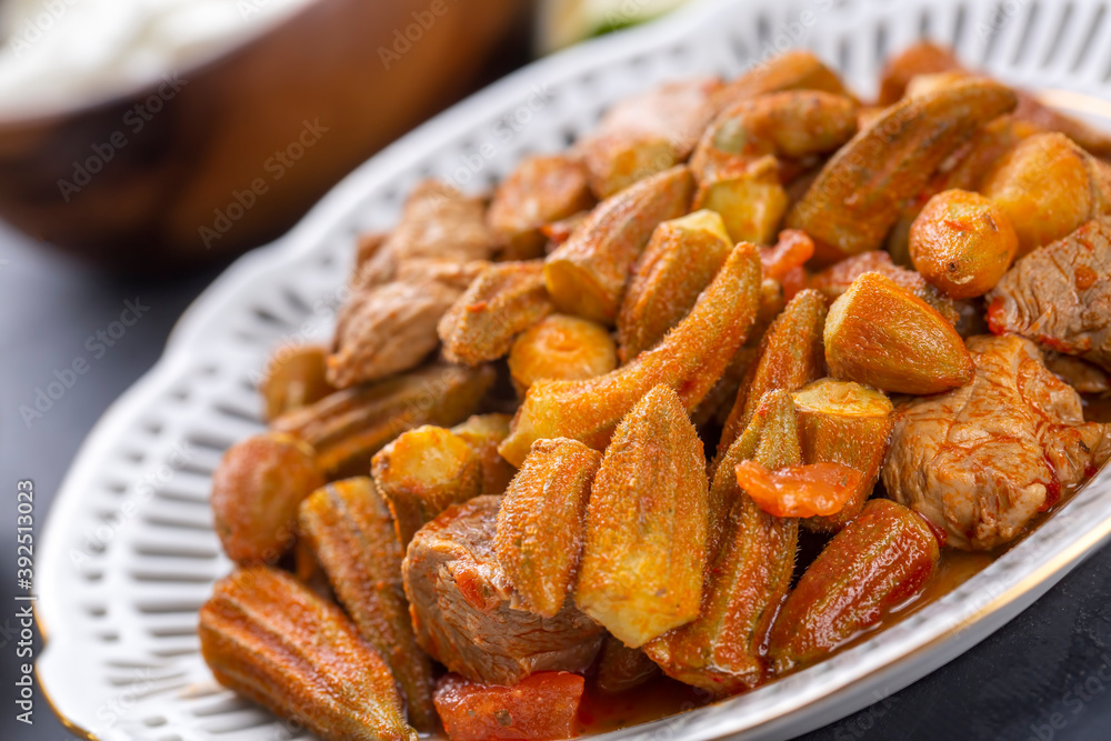 Bamya, Turkish traditional food. (Turkish cuisine) Homemade Food Okra in Plate. Organic Food. Bamya, Turkish traditional food. (Turkish cuisine) Homemade Food Okra in Plate. Organic Food.