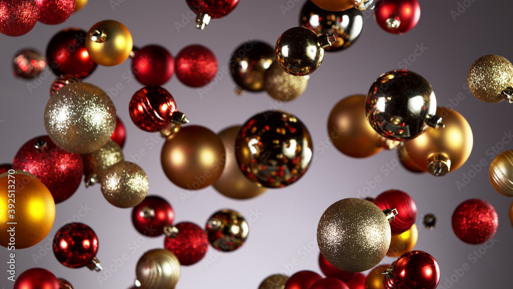 Flying christmas balls on coloured background Flying christmas balls on coloured background