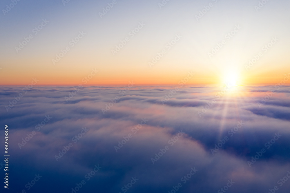 Arial view from plane on the sunrise sky
