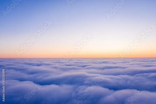 Arial view from plane on the sunrise sky © Jag_cz