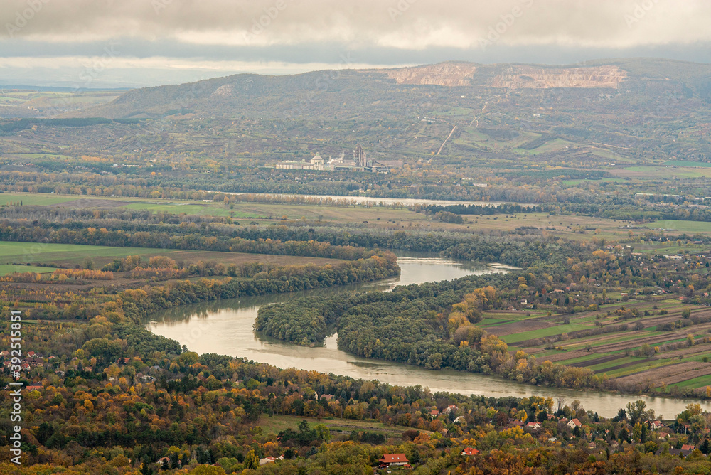 Naklejka premium Autumn Danube bend panorama with clouds from Pilis, background of the Naszály mountain.
