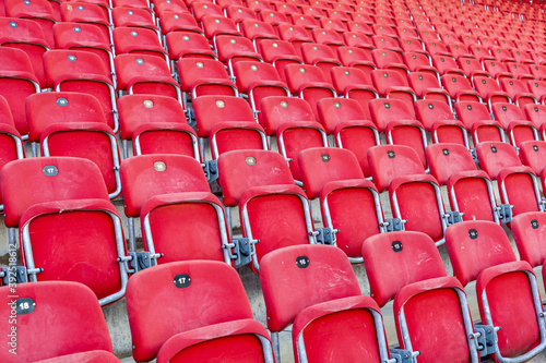 empty red seats in a football stadium