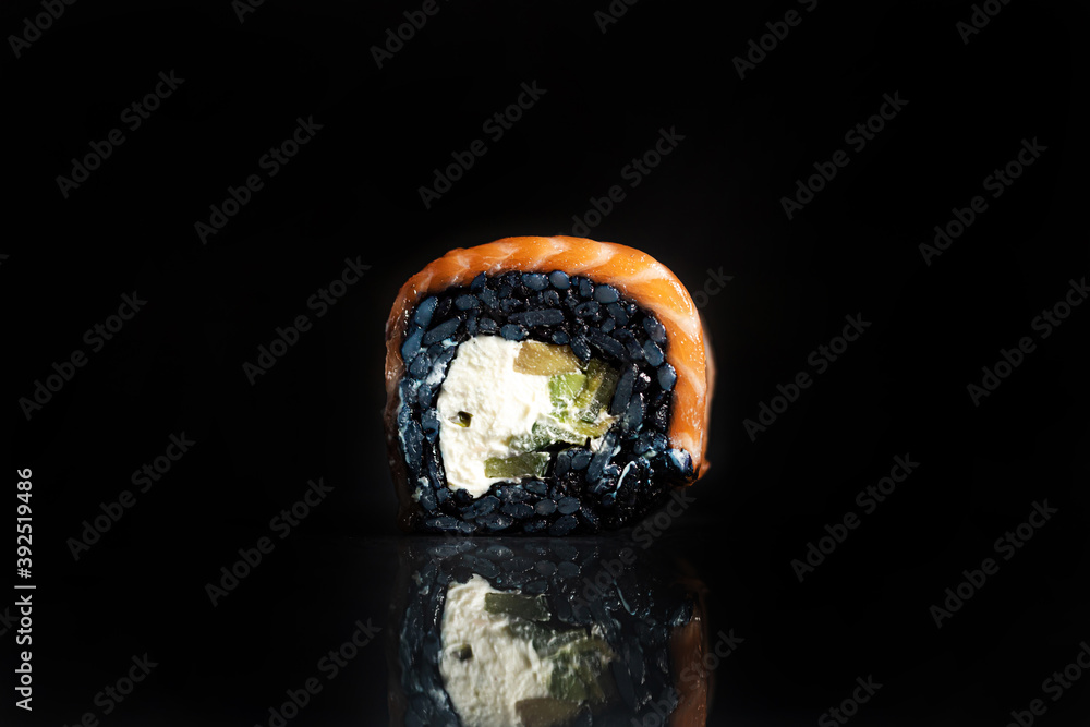Sushi Rolls Set, maki, philadelphia and california rolls, on a Black background. Sushi Rolls Set, maki, philadelphia and california rolls, on a Black background.