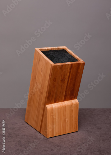 Wooden knife block on grey background 