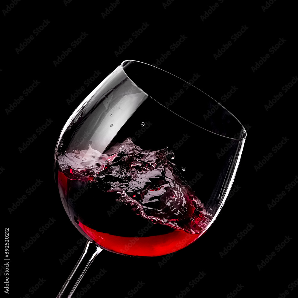 Red wine glass plash on black background Stock Photo | Adobe Stock