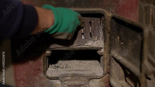 Set fire an old furnace in dirty cellar. 4K shot.