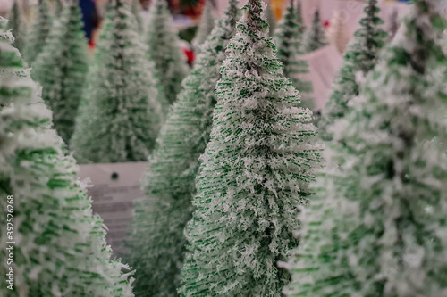 Forest of small decorative Christmas trees.