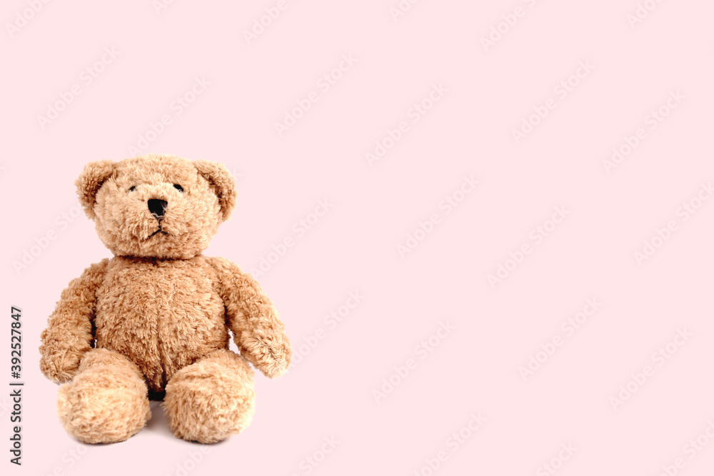 Teddy bear on bright pastel pattern background. Minimal pink compostition. Soft toy concept. Teddy bear on bright pastel pattern background. Minimal pink compostition. Soft toy concept.