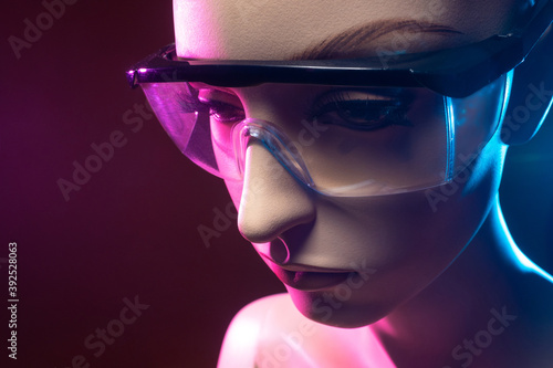 Safety glasses on the mannequin. Close-up of a mannequin face in safety glasses. Mannequin on a dark background. Concept - safety glasses. Sale of protection workwear. Individual protection means.