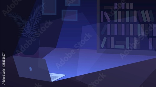 Open laptop on the floor and light from the screen in a dark room.