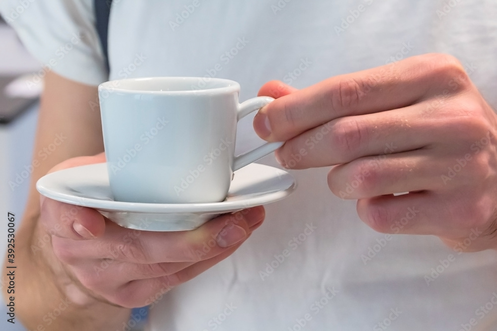 white coffee mug in men's hands white coffee mug in men's hands