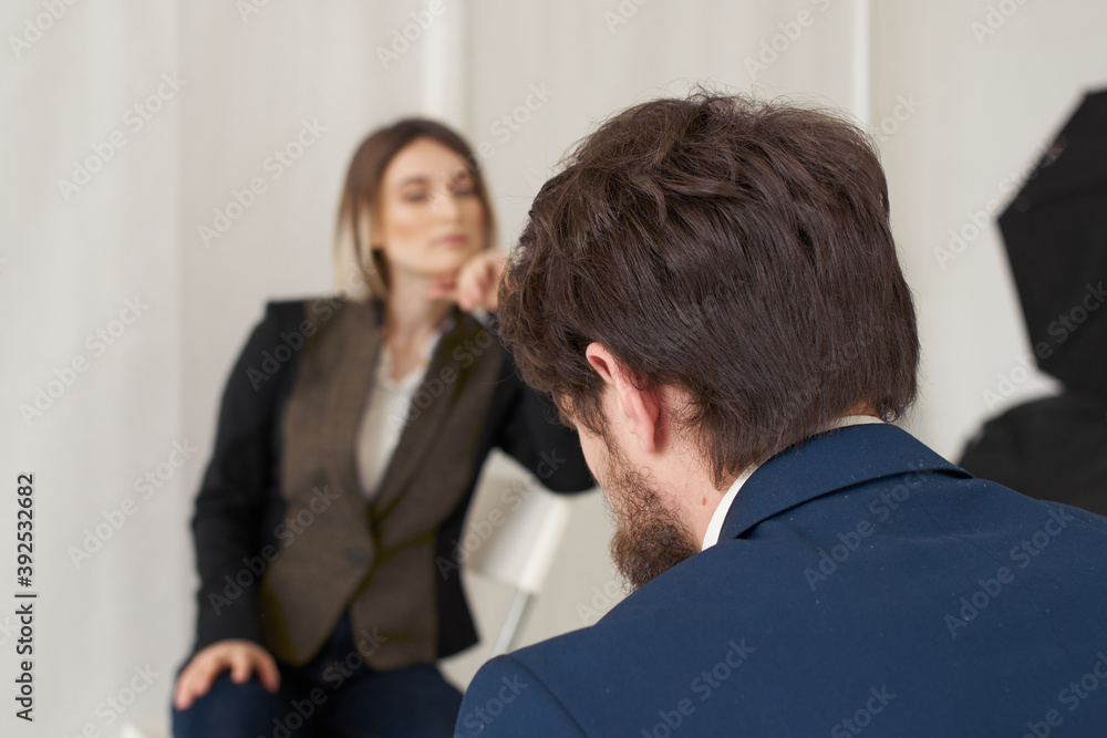 Business man communicates with a woman in a suit, staff vacancies resume Business man communicates with a woman in a suit, staff vacancies resume