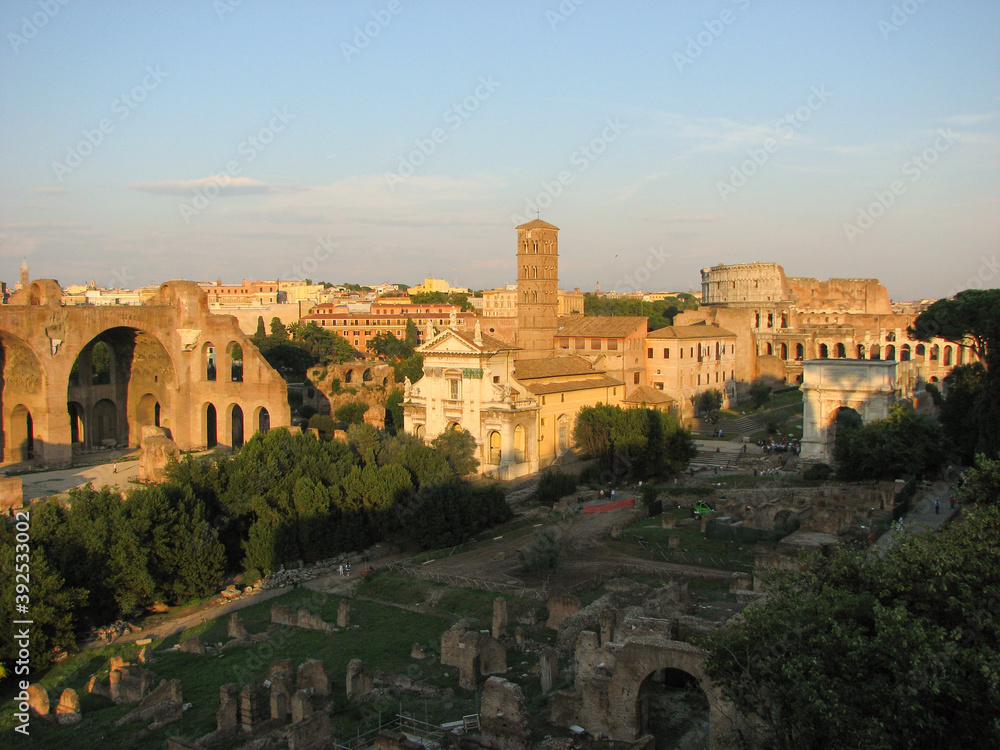 Rome, Italy - A panoramic view of the Roman Forum, a major tourist attraction featuring ancient government buildings at the center of the city of Rome.  Image has copy space.