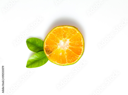 Orange fruit and leaves isolated on white background.