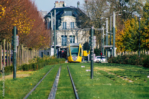 View of a modern electric tram for passengers driving through the streets and part of the public transport system of the city of Reims