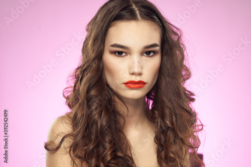 woman bright makeup red lips naked shoulders purple background