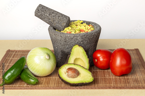 Fresh guacamole on molcajete / Bowl of guacamole 