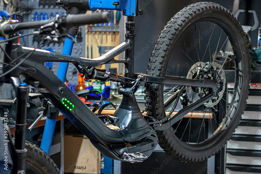 Fototapeta premium Objects tools and parts of a bicycle and the workshop where it is being fixed. 
