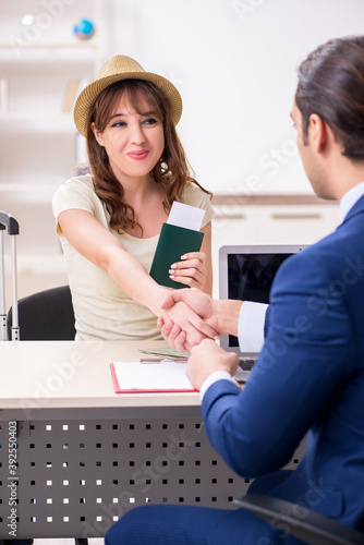 Young woman visiting embassy for visa