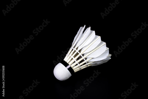 White Shuttlecock isolated on black background.