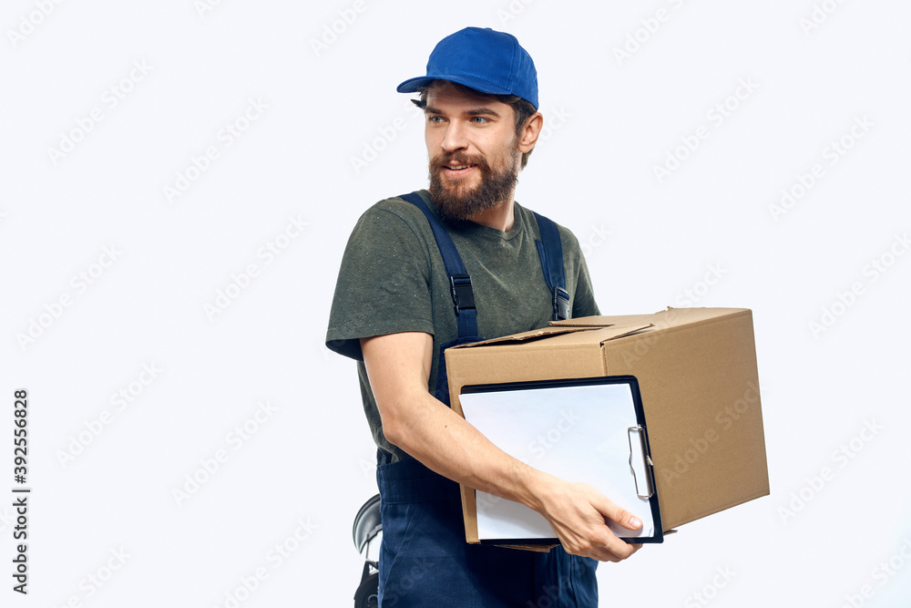 Working male courier with box in hand documents delivery service light background Working male courier with box in hand documents delivery service light background