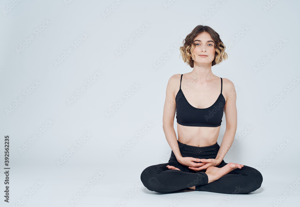 Meditation yoga woman asana light background crossed legs
