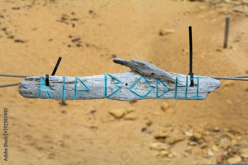 RIP Bodhi nameplate sign on wooden stick Bells Beach surfing iconoc spot Australia, Victoria state, Great Ocean road photo