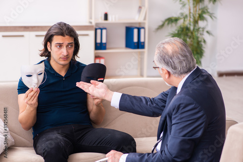 Young man wearing masks during psychotherapy session