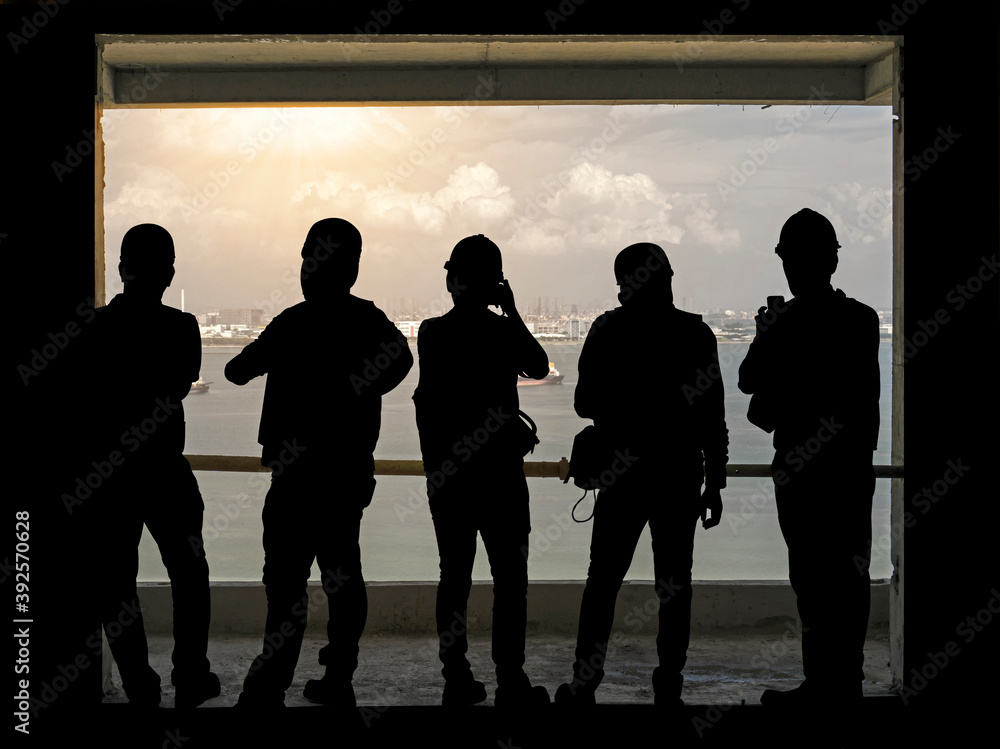 Group of black shadow of men standing in line on balcony  silhouette photo
