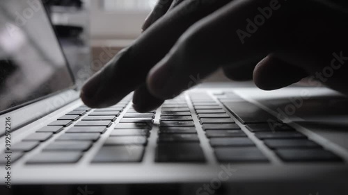 Male african american user hands typing on laptop keyboard sit at table, mixed race ethnic student professional study work with pc software technology concept, close up view