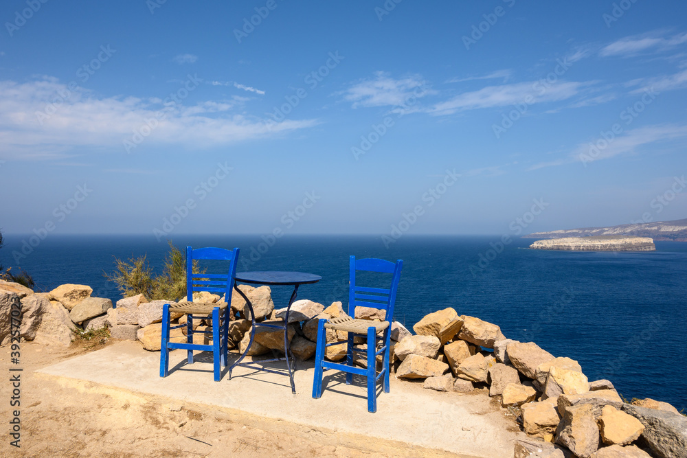 Table and chairs overlooking the caldera in Santorini island. Cyclades, Greece