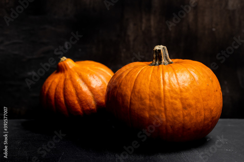 Autumn pumpkins dark mood black background