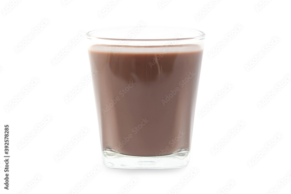 Chocolate milk puddle in glass isolated on white background. Chocolate milk puddle in glass isolated on white background.
