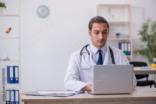 Young male doctor in telemedicine concept