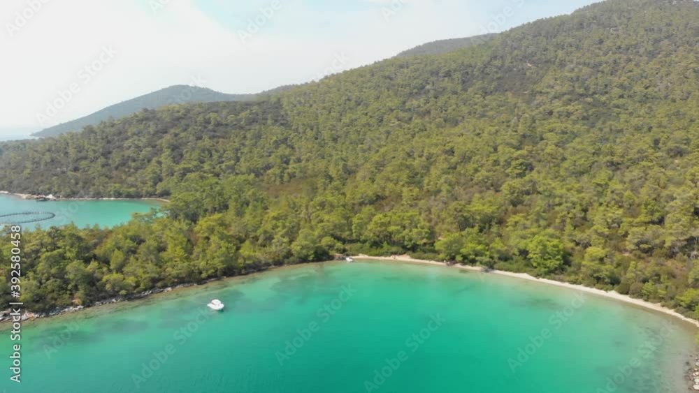Aerial nature landscape of secret bay of Aegean Sea where green and blue meets. Pure nature with incredible clear green waters on a summer day in Didim, Turkey Aerial nature landscape of secret bay of Aegean Sea where green and blue meets. Pure nature with incredible clear green waters on a summer day in Didim, Turkey
