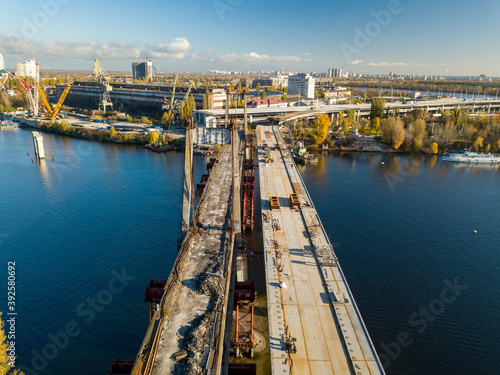 Bridge construction site in Kiev. Sunny autumn morning. Aerial drone view. © Sergey