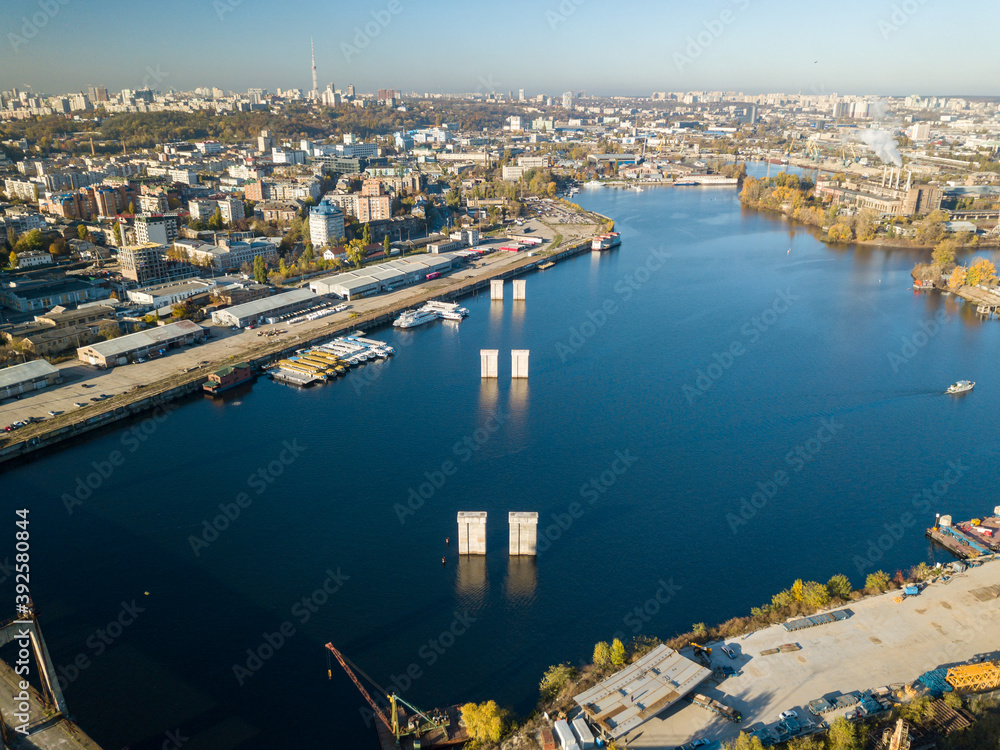 Bridge construction site in Kiev. Sunny autumn morning. Aerial drone view.
